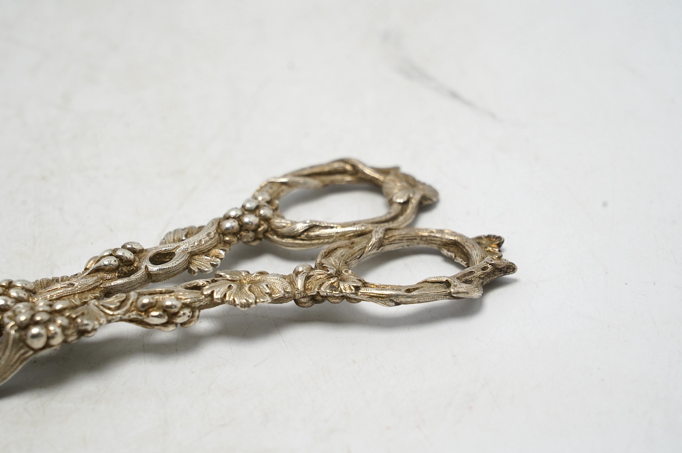 A pair of late Victorian silver grape shears, with fruiting vine handles, by William Summers, London, 1879, 18.9cm. Condition - fair to good